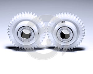 Two cogwheels on white