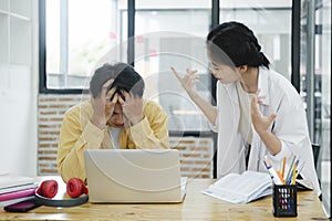 Two colleagues arguing at work. Colleagues arguing in office, problems at work...
