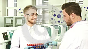 Colleagues in the laboratory discuss the results of their activities