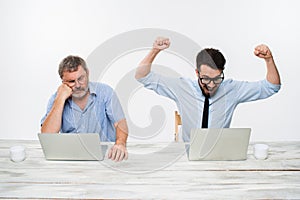 The two colleagues working together at office on white background