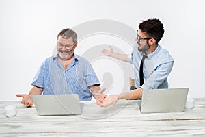 The two colleagues working together at office on white background