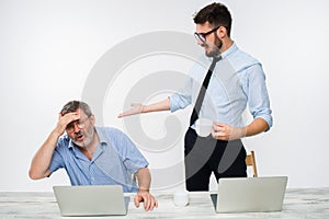 The two colleagues working together at office on white background