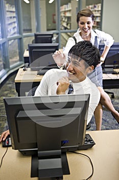 Two college students hanging out in library