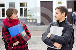 Two college students talking and flirting