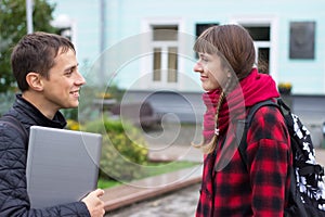 Two college students talking and flirting