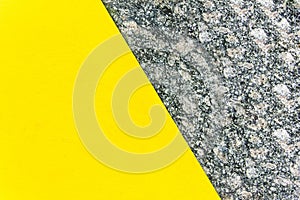 Two-color abstract background. Part yellow and part marble. Texture of natural marble background.