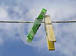 Two color pegs in a cloth line