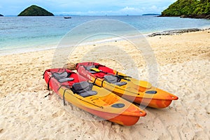 Two colorful canoe on the beach.