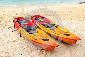 Two colorful canoe on the beach.