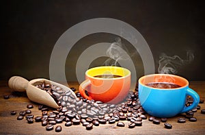 Two colorful espresso cups and coffee beans, space for text.