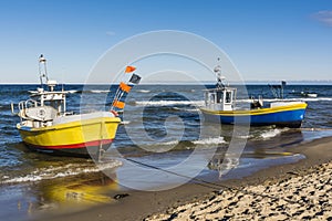 Two colorful fishing boats.