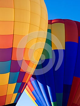 Two colorful hot air balloons on the ground