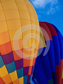 Two colorful hot air balloons on the ground