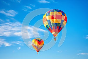 two colorful hot air balloons on the sky