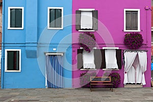 Two colorful houses of Burano Island, Venice, Italy