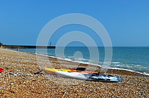 Two colorful kayaks at Seven sisters Beach.