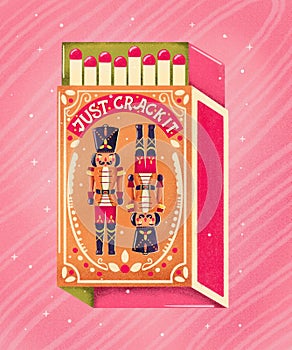 Two colorful nutcrackers on a matchbox with hand lettering on a pink background. Colorful festive winter Merry Christmas