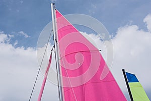 Two colorful  sails of sailboats