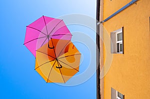 Two colorful umbrellas