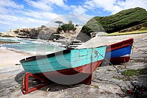 Two colourfull fishing boats docked