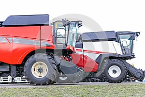 Two combines for harvesting grain.