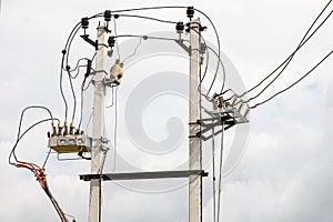 Two concrete electricity power pole connected with electric wires cable line