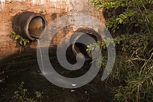 Two concrete pipes of sewers on open air