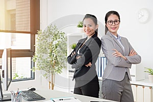Two confidence Asian office lady cross arms photo