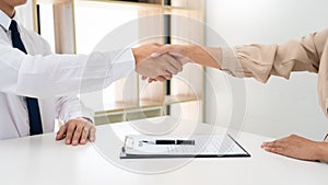 Two confident business man shaking hands during a meeting in the office, success, dealing, greeting and partner concept