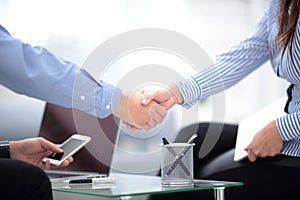 Two confident business man shaking hands during a meeting in office, success, dealing, greeting and partner concept.