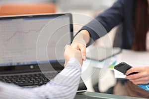 Two confident business man shaking hands during a meeting in office, success, dealing, greeting and partner concept.