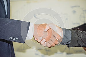 Two confident businessman shook hands during office meetings