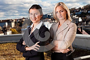 Two confident businesswomen ouside