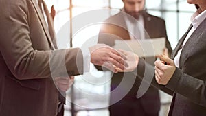 Two confident diverse businessmen shaking hands during meeting in office