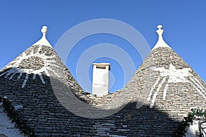 Two conical roofs of the trulli houses in Alberobello, Apulia - Italy