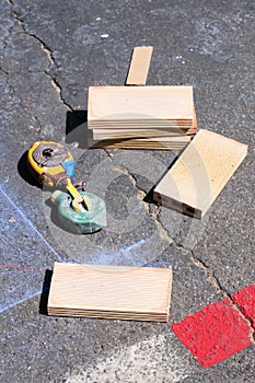 Two construction drawings and bricks on a construction site