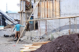 Construction site with workers building concrete.