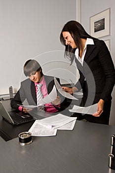 Two contemporary businesspeople at a meeting