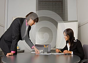 Two contemporary businesspeople at a meeting