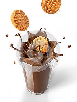 Two cookies biscuits falling into chocolate milkshake glass, for