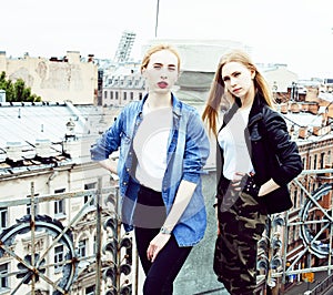 Two cool blond real girls friends making selfie on roof top, lifestyle people concept, modern teens