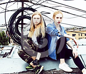 Two cool blond real girls friends making selfie on roof top, lifestyle people concept, modern teens