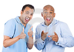 two cool guys pointing fingers at you gesture and smiling