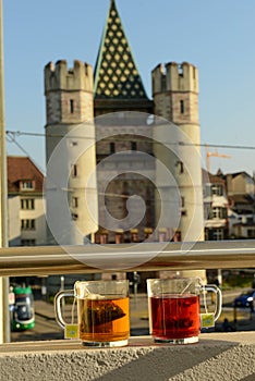 Two cops of tea in front of Spalentor gate at Basel in Switzerland