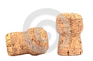 Two corks of champagne close-up on a white background