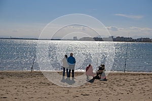 Two couple of elderly people are fishing