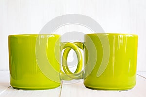 Two coupled coffee mugs