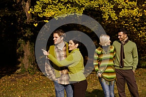 Two couples in autumn park