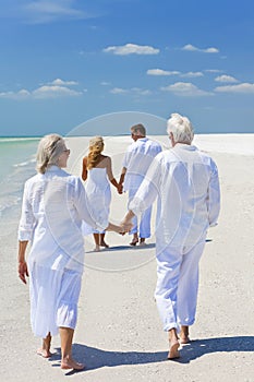 Two Couples Family Generations Walking on Beach