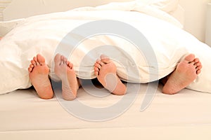 Two couples of feet